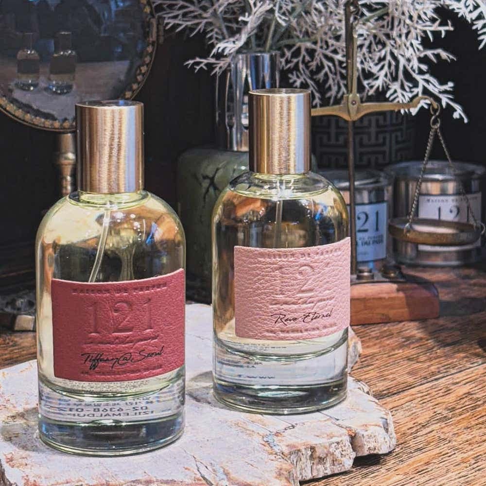 Custom fragrance bottles with engraved leather labels
